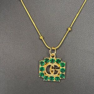 GG Zipper pull charm with Green Accents on gold plated chain